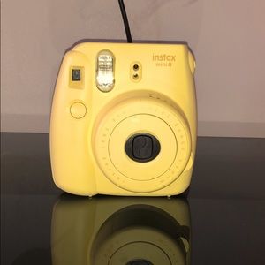 Yellow Instax polaroid camera